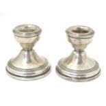 A pair of short silver candlesticks, Hallmarked Birmingham 1968 maker W.I. Broadway & Co. Approx.