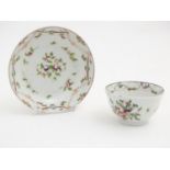 A 19thC New Hall tea bowl and saucer with floral decoration, pattern no. 241. Tea bowl approx. 2"