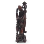 A 20thC Chinese carved wooden figure modelled as an elder with a scroll and crane bird. Approx.