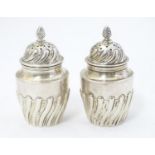 A pair of Victorian silver pepperettes hallmarked Sheffield 1891 maker Harrison Brothers & Howson