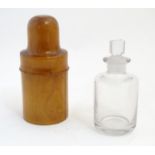 A Victorian 6oz medicine bottle contained within a treen turned boxwood travel case stamped S.