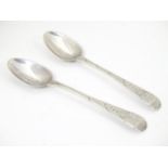 A pair of silver teaspoons with bright cut hallmarked London 1785, maker GS. 5" long (2) Please Note