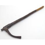 Ethnographic / Native / Tribal: A club with a leather bound handle and metal end. Approx. 22 1/4"