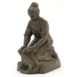 An early 20thC Continental cast model of a washerwoman after Jan H. Schoenmakers, stamped VVV Beek-