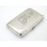 An Edwardian silver cheroot / cigarette case with engraved armorial detail, hallmarked Birmingham