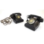 Two early 20thC Bakelite black rotary dial telephones, no. 332. Approx. 6" high (2) Please Note - we