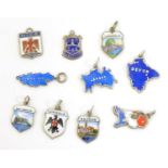 Assorted silver and silver plate charms including 3 silver pendant charms with blue enamel