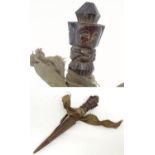 Ethnographic / Native / Tribal: A wooden carving of stylised dagger form with three carved faces