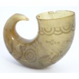 A 19thC rams horn vessel / flask with engraved foliate and roundel decoration. Approx. 4 1/2" long