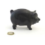A Sylvac matte black money / piggy bank modelled as a pot bellied pig, no. 1132. Approx. 3" high