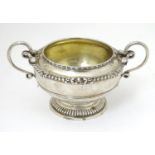 A Victorian silver sugar bowl with twin handles, hallmarked London 1866, maker Edward & John