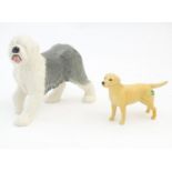 Two Beswick models of dogs comprising a Golden Labrador, no. 1548, and an Old English Sheepdog,