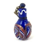 A miniature scent bottle with enamel decoration. 1 1/2" long Please Note - we do not make
