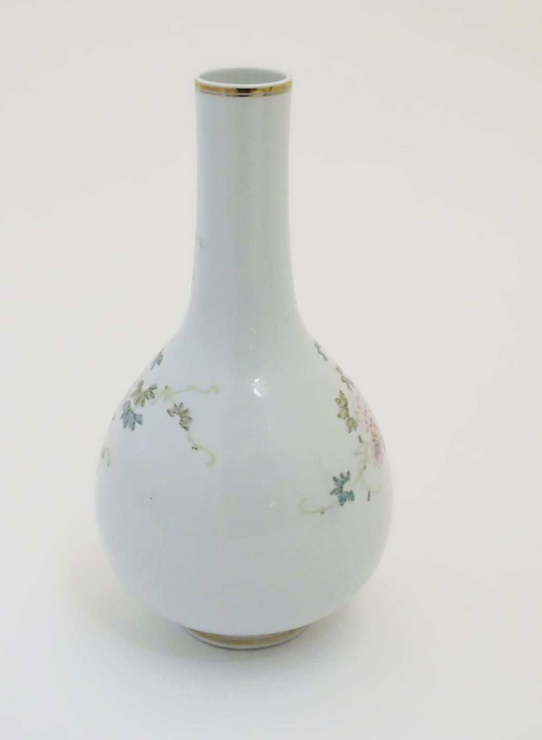 A Chinese globular vase with an elongated neck decorated with peacocks and flowers in a landscape, - Image 4 of 6