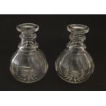 A pair of small carafes / decanters. approx. 6" high Please Note - we do not make reference to the