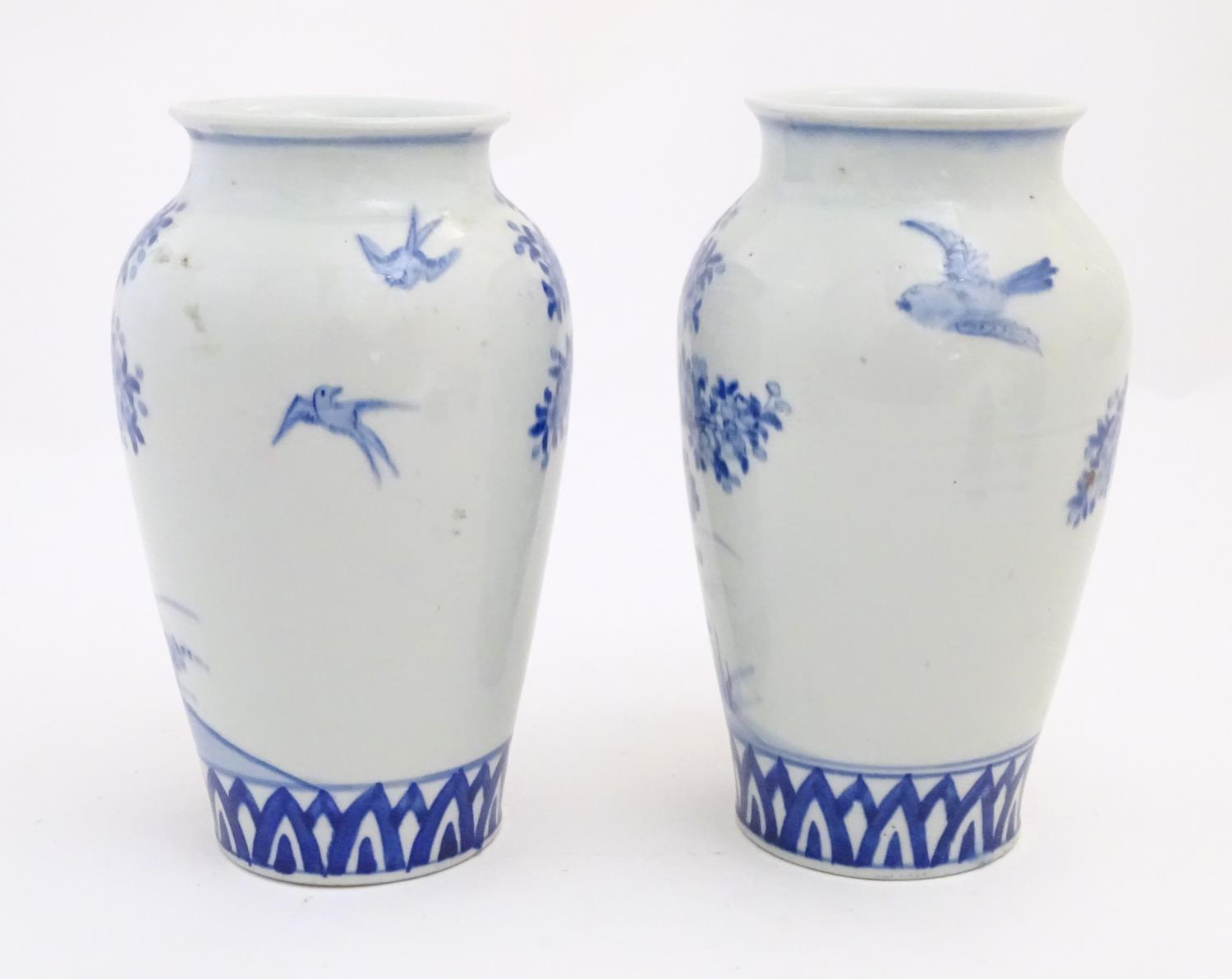 Two Chinese blue and white vases decorated with landscape scene with birds and trees. Approx. 9 3/4" - Image 4 of 6