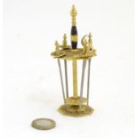 A 20thC set of four miniature Toledo swords in a gilt and enamel stand. Approx. 4 1/2" high Please