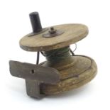 Fishing: an early 20thC hardwood and brass centrepin fishing reel, 3 5/8" in diameter Please