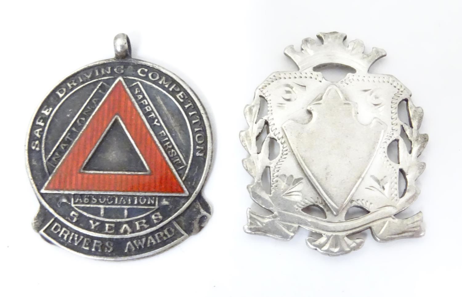 A hallmarked silver fob medal, the obverse decorated with the insignia of the National Safety