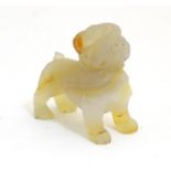 A 20thC hardstone carving modelled as a dog, possibly a bulldog. Approx. 2 1/4" high Please Note -