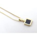 A 9ct gold pendant on chain approx. 14" long Please Note - we do not make reference to the condition