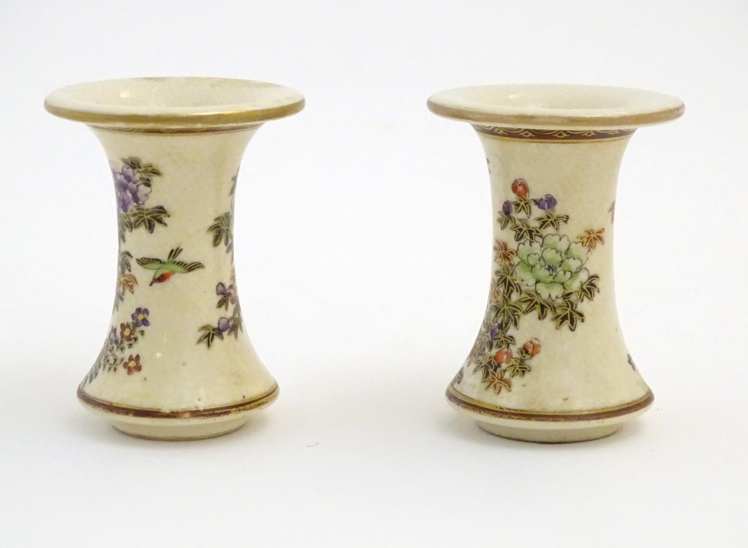 A pair of Japanese miniature Satsuma vases with flared rims and bases, decorated with flowers and - Image 3 of 8