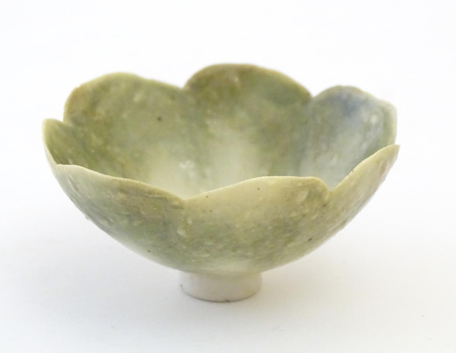 An Arts & Crafts miniature footed bowl formed as a flower with petal detail. Marked with monogram
