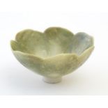 An Arts & Crafts miniature footed bowl formed as a flower with petal detail. Marked with monogram