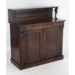 An early / mid 19thC rosewood chiffonier with a panelled upstand raised by carved lion supports,