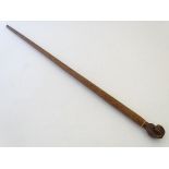 An early 20thC Pitcairn Island folk art walking stick, of native hardwood construction, the knop