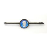 A white metal bar brooch, stamped STERLING BERMUDA, the central circular section containing a