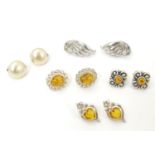 5 assorted pairs of silver and silver plate earrings, some set with amber cabochon Please Note -
