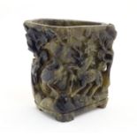 An Oriental carved soapstone libation cup / vase / brush washer pot, depicting a mountain