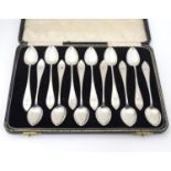 A Set of 12 Continental .830 silver teaspoons with bright cut decoration. Maker?s mark P.A.Ø.