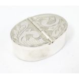 A silver two sectional pill box with engraved decoration to the hinged lids. 1 3/4" wide Please Note