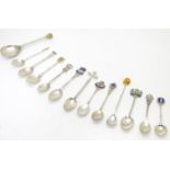 A collection of assorted silver and white metal souvenir / commemorative / novelty teaspoons etc (