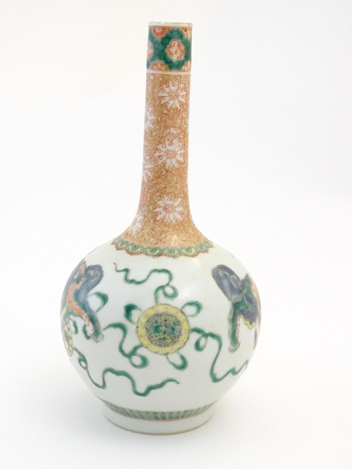 A Chinese bottle vase decorated with stylised foo dogs / dragons. The neck with floral and foliate - Image 4 of 7