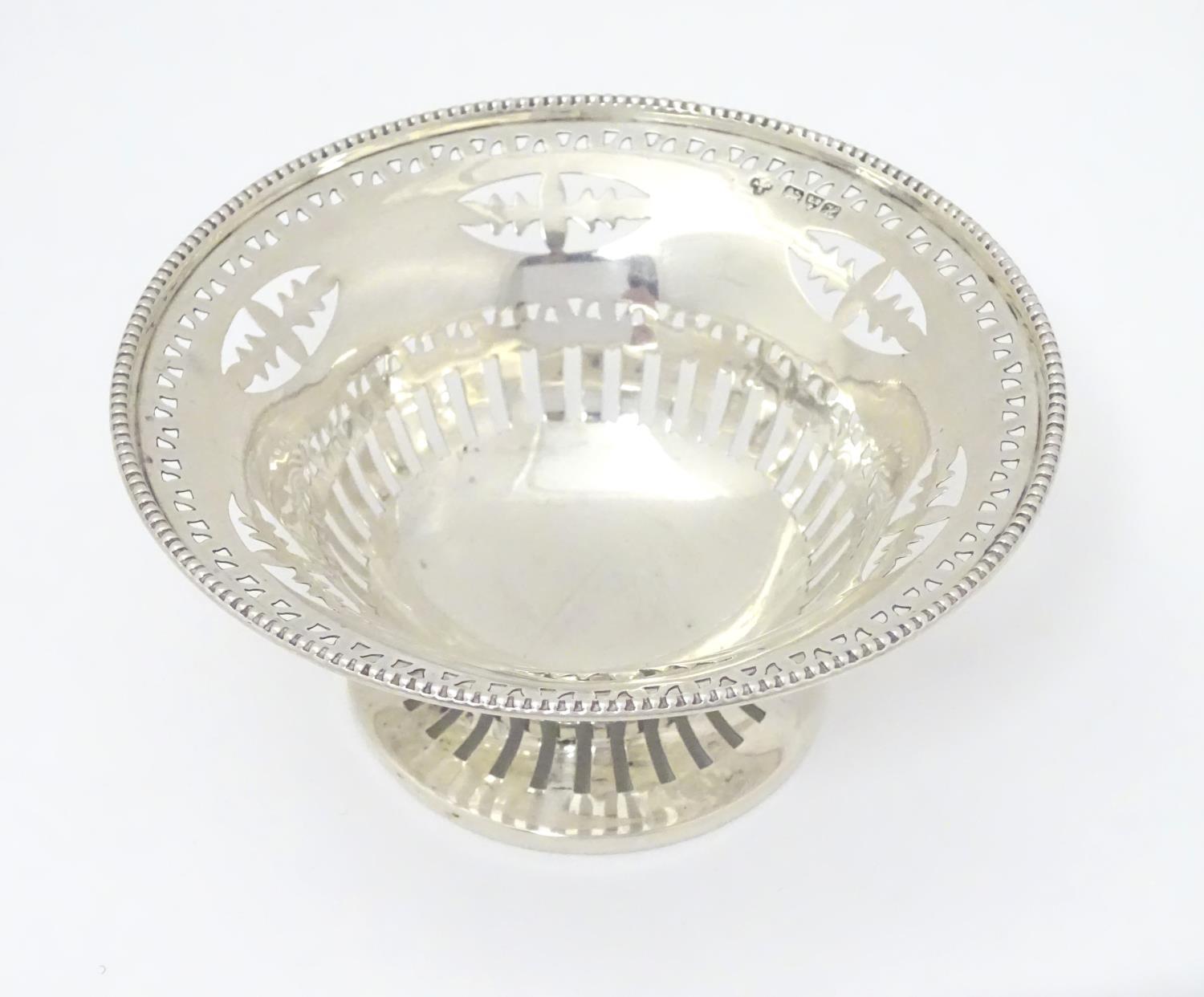 A silver bonbon dish with beaded edge and pierced decoration raised on circular foot. Hallmarked - Image 3 of 6