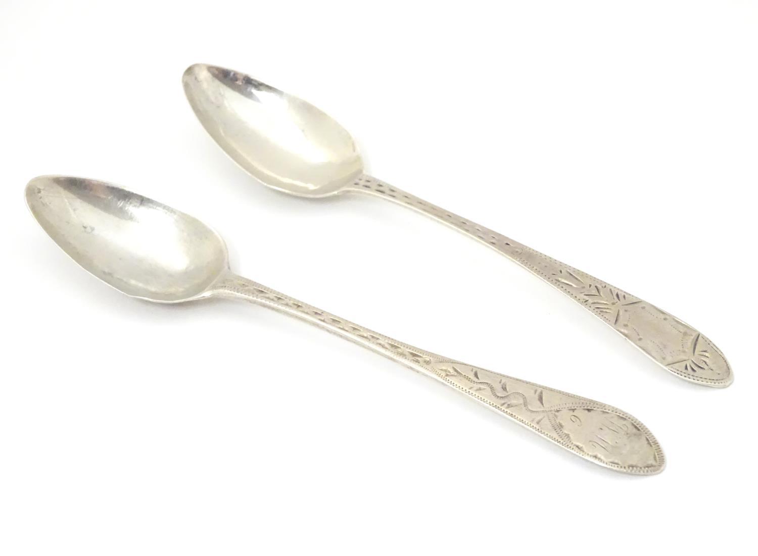 Two Geo III Scottish Celtic point teaspoons with bright cut decoration 5 1/4" long Please Note -