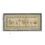 An early 20thC sampler / embroidery / needlework, with the religious script Bear the cross, Wear the