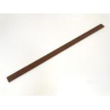 A large Victorian rule / ruler with brass mounts. 44" long Please Note - we do not make reference to