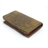 An early 20thC crocodile skin clutch handbag, with Reptile Store, Singapore label within. Approx. 5"