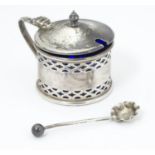 A Silver mustard pot with pierced decoration, hallmarked Birmingham 1929, maker Clifford Brothers,