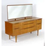 Vintage retro, mid-century: a 1960s British made teak dressing table, with fixed mirror and seven