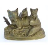 A Continental cast sculpture depicting a fox and two fox cubs with traces of gilt finish. Approx.