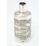 A silver bottle cover with embossed detail, hallmarked London 1901 maker Goldsmiths & Silversmiths