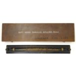 Militaria: a mid to late 20thC cased naval navigational parallel rolling rule, the case marked '