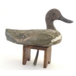 Shooting, sporting collectables: an early 20thC hand carved & painted decoy duck, with line tether
