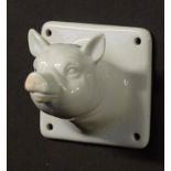 A ceramic novelty coat hook formed as a pigs head. Approx 3" high x 3"wide x 3" deep. Please