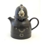 A Carlton Ware novelty policeman teapot. Marked under. Approx. 8 1/2" high Please Note - we do not